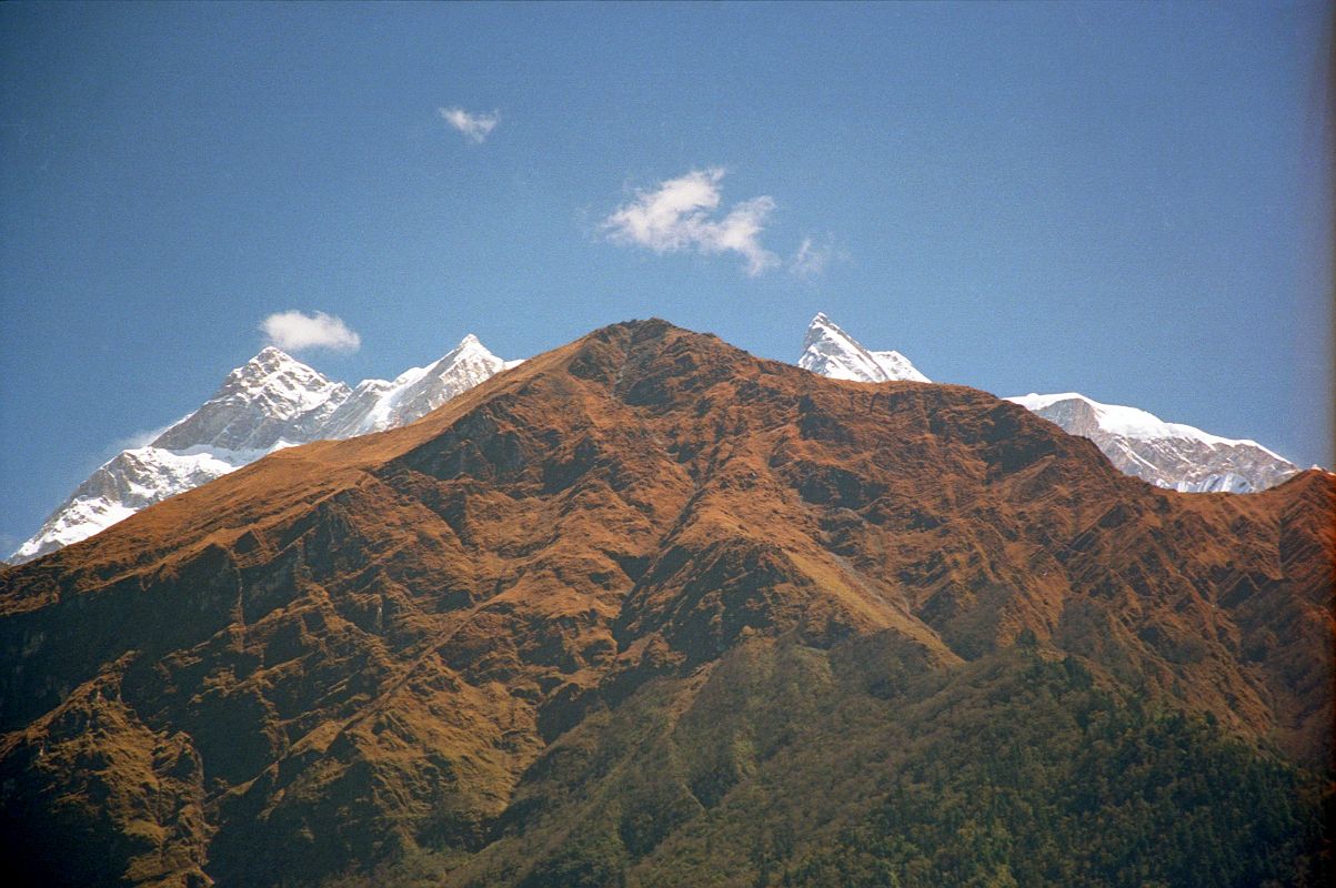 404 Annapurna  Northwest Face, Thulo Bugin, Fang From Lete Annapurna Northwest Face is visible from Lete, with the grassy slopes of Thulo Bugin, and then Fang poking up to the right. The trek to Annapurna North Base Camp goes via Thulo Bugin.